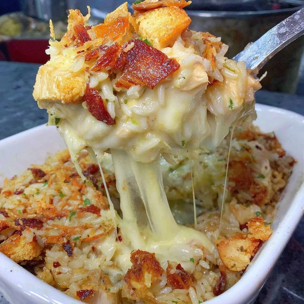Delicious French Onion Chicken Rice Bake topped with melted cheese and herbs.