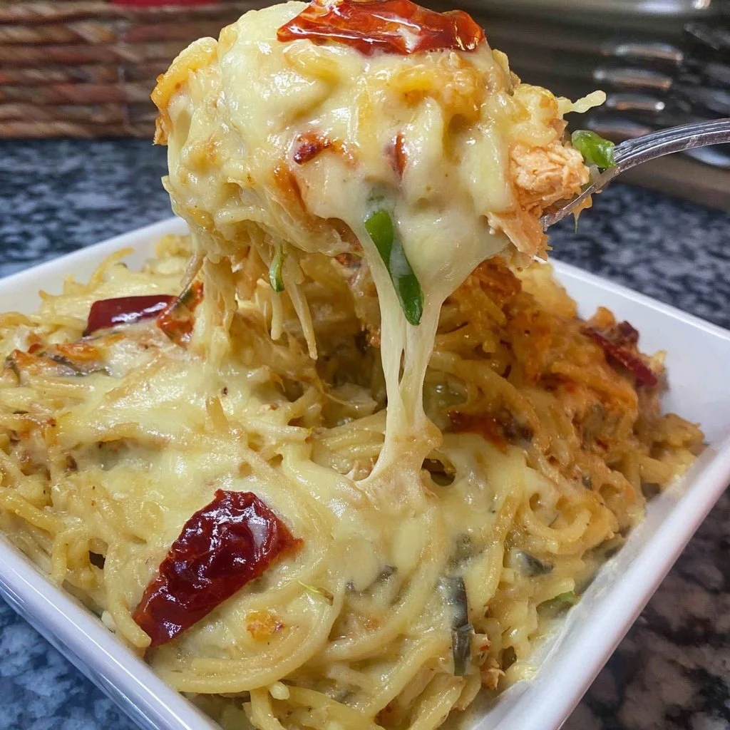 Spicy Southern Cheesy Chicken Spaghetti Casserole topped with melted cheese
