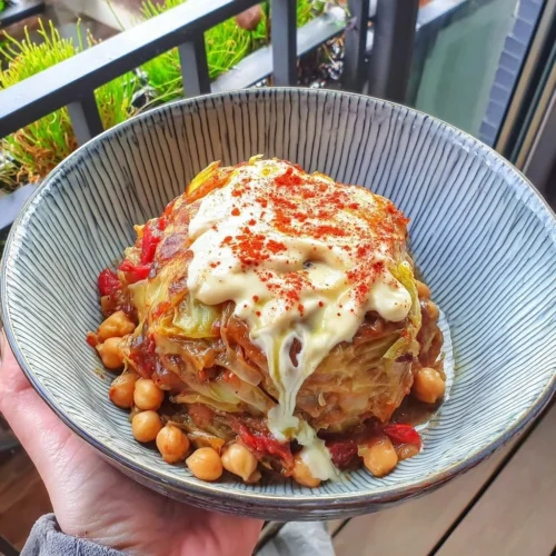 Braised cabbage and chickpea casserole with smoked paprika in a rustic dish