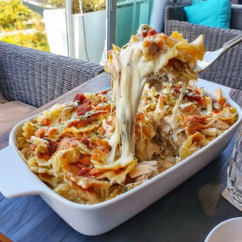 Viral Cabbage Alfredo Chicken Casserole in a baking dish ready to serve