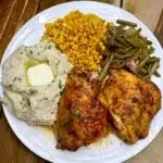 Baked chicken thighs dinner with green beans, corn & mashed potatoes